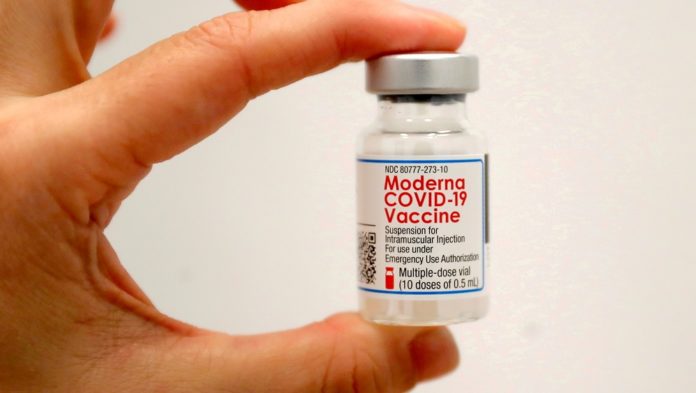 FILE PHOTO: A healthcare worker holds a vial of the Moderna COVID-19 vaccine in New York City