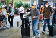 China pondrá fin a la cuarentena por covid para llegadas de viajeros extranjeros en medio de una explosión de casos