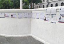 Familiares pegan en espacios públicos fichas de hijas, hijos y padres desaparecidos